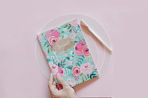 Floral journal/notepad on a pink background