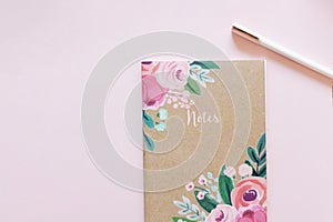 Floral journal/notepad on a pink background