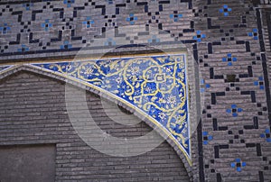 Floral mosaic on exterior of Madrese-e Khan