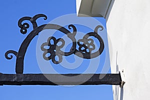 Floral ornament in metal above the gate to the church