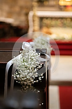 Floral ornamentation inside a worship space, church. Festive decoration for wedding event