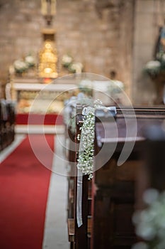Floral ornamentation inside a worship space, church. Festive decoration for wedding event