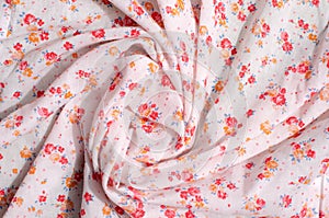 Floral pattern on a crumpled fabric.