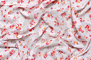 Floral pattern on a crumpled fabric.