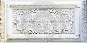 Floral pattern. Oriental style marble carving used in the outer part of the mausoleum of Mohammed V in Rabat Morocco, Africa photo