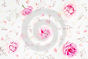 Floral pattern of pink roses, wild flowers and petals on white background. Valentines day. Flat lay, Top view.