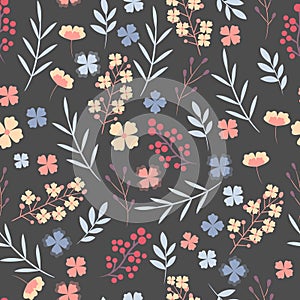 Floral pattern. Pretty flowers on dark blue background. Printing with small colorful flowers. Ditsy print. Seamless