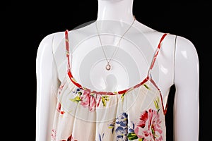 Floral pattern sarafan and necklace.