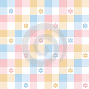 Floral pattern for spring summer. Colorful pastel abstract vichy tartan check plaid with daisy flowers in blue, pink, yellow.
