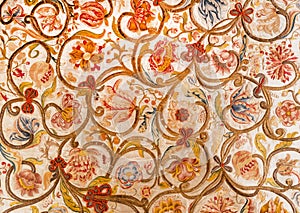 Floral patterns on painted textile from Sicily. Design of silk carpet from 17th century. Italian vintage