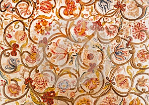 Floral patterns on painted textile from Sicily. Design of silk carpet from 17th century. Italian vintage photo