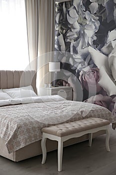 Floral photoart work used as wallpaper in bedroom interior