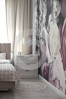 Floral photoart work used as wallpaper in bedroom interior