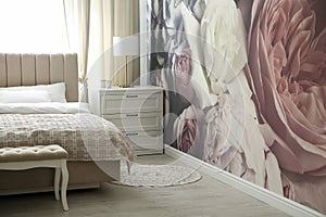 Floral photoart work used as wallpaper in bedroom interior