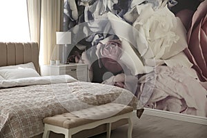 Floral photoart work used as wallpaper in bedroom interior