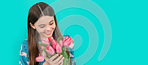 floral present. happy child with tulips. mothers or womens day. Banner of spring child girl with tulips flowers bouquet