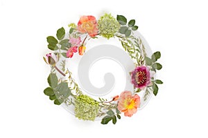 Floral round crown wreath with flowers and leaves.