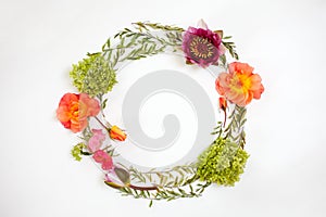 Floral round crown wreath with flowers and leaves.