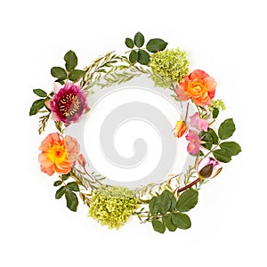 Floral round crown wreath with flowers and leaves.