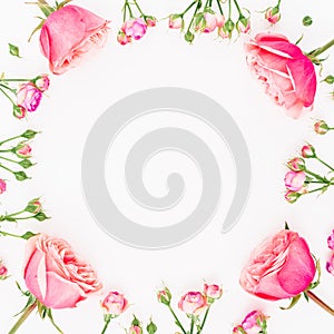 Floral round frame made of pink roses isolated on white background. Flat lay, top view. Valentines day background.