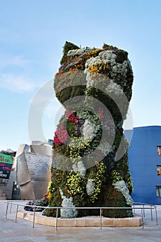 Floral sculpture of Puppy by Jeff Koons in front of Guggenheim Museum Bilbao.