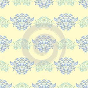 Floral seamless background. Blue and green flower pattern on beige backdrop