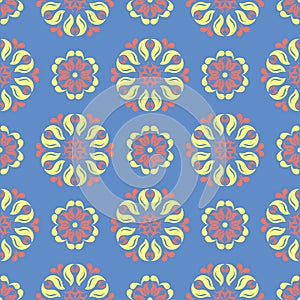 Floral seamless pattern. Blue background with colored flower elements