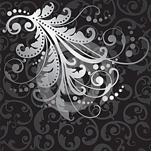 Floral silver design element on black swirls pattern