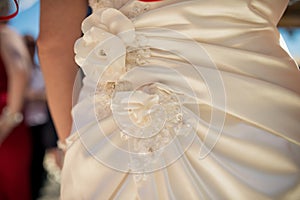 Floral and silver details of a brides beautiful dress