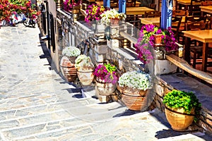 Floral streets and restaurants of old town Naxos. Ciclades islands of Greece
