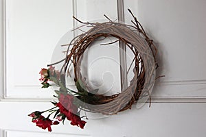 Floral wreath made up of flowers and dried twigs