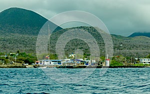 Floreana island bay with mountains on background photo