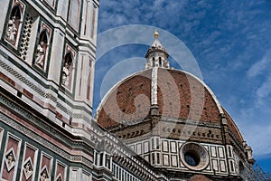 Florence Cathedral cupula in Italy with a blue sky in the background. photo