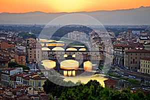 Florence cityscape and Arno river bridges sunset view