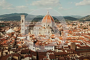 Florence cityscape. Red tile roofs and 14th century Duomo in historical area, Italy