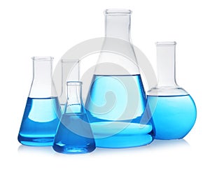 Florence and conical flasks with blue liquid on background. Laboratory glassware