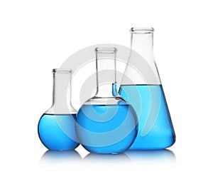 Florence and conical flasks with blue liquid on background. Laboratory glassware