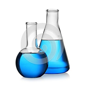 Florence and conical flasks with blue liquid on background. Laboratory glassware