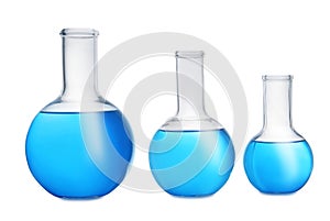 Florence flasks with blue liquid on white. Laboratory glassware