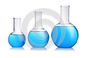 Florence flasks with blue liquid on white. Laboratory glassware