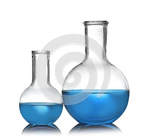 Florence flasks with liquid samples. Chemistry glassware