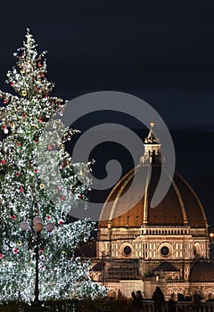 Florence. Illuminated Christmas tree at Piazzale Michelangelo with the Dome of Cathedral Santa Maria del Fiore on the background.