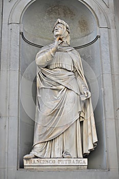 FLORENCE, ITALY - JANUARY 11, 2019: Francesco Petrarca statue in the Niches of the Uffizi Colonnade in Florence, Italy photo