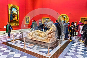 FLORENCE, ITALY, MARCH 15, 2016: Doni Tondo statue by Michelangelo is situated in the red room of the uffizi gallery in