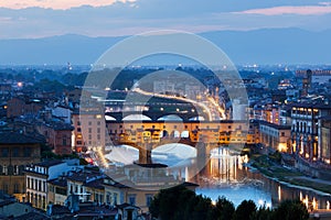 Florence, Italy night skyline. Ponte Vecchio bridge over Arno River.