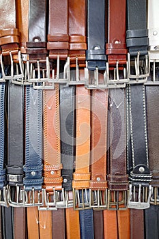 Florence, Italy - 22 Nov, 2022: Belts and leathers goods for sale near Florence Central market photo