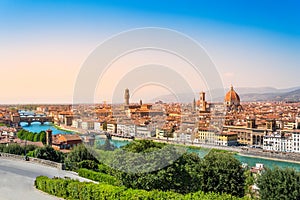 Florence, Italy: scenic view on famous italian town with Duomo and Arno river at sunset