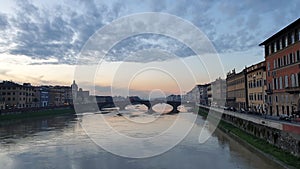 Florence Italy sunset view over river. Panning slow motion video  bridges and panoramic beatiful architecture