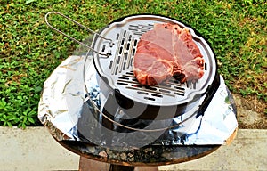 Uncooked Florentine Steak on the grill, bistecca alla fiorentina photo