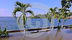 Flores, Guatemala, water taxis and tour boats crossing Santa Elena lake